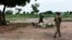 FILE - A soldier from Sudan People's Liberation Army-In Opposition (SPLA-IO) walks goats in Leer, Unity State.