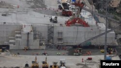 រូបឯកសារ៖ កម្មករធ្វើការនៅទំនប់វារីអគ្គិសនី Grand Renaissance Dam នៅប្រទេសអេត្យូពី កាលពីថ្ងៃទី២៦ ខែកញ្ញា ឆ្នាំ២០១៩។ 