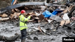 A rescue worker at the mudslide that hit Washington state on March 22, 2014.