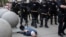 Martin Gugino lays on the ground after he was shoved by two Buffalo, New York, police officers during a protest against the death in Minneapolis police custody of George Floyd in Buffalo, New York