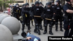 Martin Gugino lays on the ground after he was shoved by two Buffalo, New York, police officers during a protest against the death in Minneapolis police custody of George Floyd in Buffalo, New York
