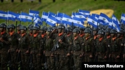 Troops attend a military ceremony where El Salvador's President Nayib Bukele (not pictured) is being presented with the commander's baton, in San Salvador, El Salvador, June 11, 2019. 