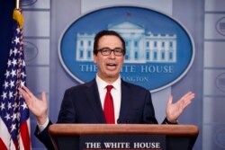 FILE - Treasury Secretary Steve Mnuchin speaks during a news briefing at the White House, in Washington, July 15, 2019.