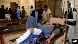 Injured victims of a bomb explosion are treated at a hospital, in Quetta, Pakistan, Dec. 30, 2021. A roadside bomb exploded outside a college in southwestern Pakistan, killing several people and wounding more than dozen, mostly passers-by, police and a rescue official said. 