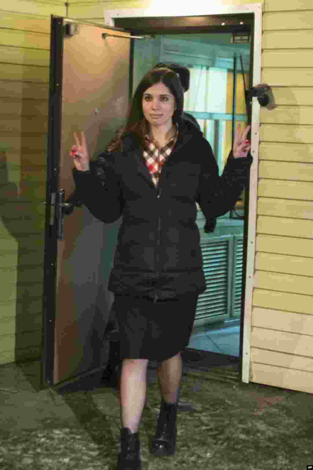 Nadezhda Tolokonnikova gestures as she leaves prison in Krasnoyarsk, Russia, Dec. 23, 2013.&nbsp;