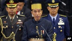 Indonesia's President Joko Widodo, center, delivers his State of The Nation address ahead of the country's Independence Day at the parliament building in Jakarta, Indonesia, Aug. 16, 2017.
