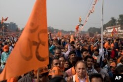 Supporters of Vishwa Hindu Parishad gather during a rally in New Delhi, Dec. 9, 2018. The right-wing group gathered thousands of supporters in the Indian capital to demand the construction of a Hindu temple on a site where a mosque was attacked and demolished in 1992.