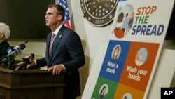 FILE - Oklahoma Gov. Kevin Stitt speaks during a news conference in Oklahoma City, July 9, 2020.