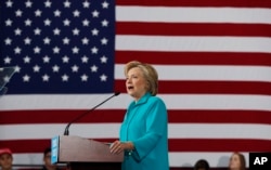 FILE - In this Aug. 25, 2016 file photo, Democratic presidential candidate Hillary Clinton speaks at a campaign in Reno, Nev. Young Hispanics, Asian-Americans and African-Americans are much more likely to trust Hillary Clinton than Donald Trump to deal with immigrants living in the United States illegally.