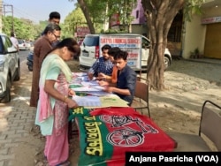Some voters arrived early Thursday to search for their names on the electoral rolls and beat long lines.