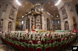 Bishops and cardinals pray as Pope Francis celebrates the opening Mass of the Synod of bishops, in St. Peter's Basilica at the Vatican, Oct. 4, 2015.