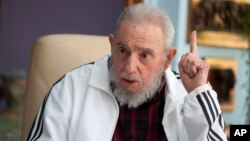 FILE - Cuba's Fidel Castro speaks with Russia's President Vladimir Putin (not seen) in Havana, July 14, 2014.