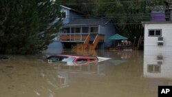 A truck is seen submerged in the flood waters of the Russian River in Forestville, north of San Francisco, Feb. 27, 2019. 