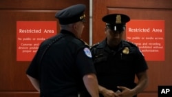 U.S. Capitol Police officers stand near a secure area during closed-door interviews as House Democrats proceed with the impeachment investigation of President Trump in Washington, Oct. 3, 2019.