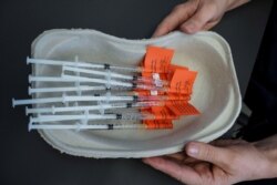 Syringes with AstraZeneca vaccine against the coronavirus disease (COVID-19) are pictured in Laakso hospital in Helsinki, Finland, March 11, 2021.