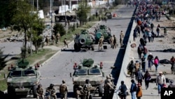 FILE - Soldiers guard the Senkata fuel plant in El Alto, on the outskirts of La Paz, Bolivia, Nov. 20, 2019.