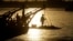 A passenger stands on the foredeck of a ferry as it crosses the Mekong river from Arey Ksat to the main city in Phnom Penh, Cambodia, July 1, 2016.