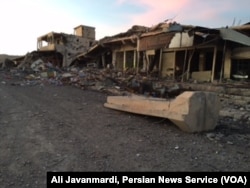 FILE - U.S. airstrikes damaged an Islamic State military base in the center of Sinjar.