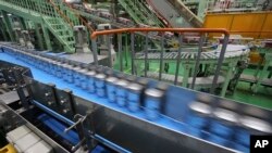 FILE - The beer production line is seen at an Asahi Breweries factory in Moriya near Tokyo, May 29, 2017.