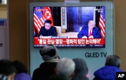 FILE - A TV shows a photo of U.S. President Donald Trump and North Korean leader Kim Jong Un, left, at Seoul Railway Station in Seoul, South Korea, Jan. 1, 2019.