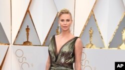 Charlize Theron arrives at the Oscars on Sunday, Feb. 26, 2017, at the Dolby Theatre in Los Angeles.