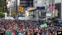 FILE - Runners take part in the New York City Marathon, Nov. 3, 2019. The annual event which this year had been scheduled for Nov. 1, 2020, has been cancelled because of the coronavirus pandemic.