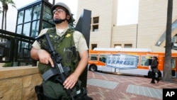 A Los Angeles Sheriffs Counter Terrorism Unit deputy patrols Union Station before the start of Los Angeles Dodgers game in Los Angeles, April 15, 2013.