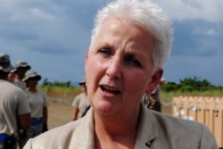 FILE - Then-U.S. Ambassador to Liberia Deborah Malac speaks to a journalist at the Roberts international airport outside Monrovia, Oct. 9, 2014.