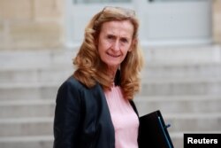 FILE - French Justice Minister Nicole Belloubet leaves following the weekly cabinet meeting at the Elysee Palace in Paris, France, Oct. 17, 2018.