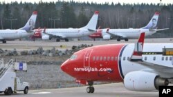 FILE - Boeing 737-800 aircraft belonging to budget carrier Norwegian are parked at Stockholm Arlanda Airport, March 5, 2015.