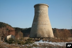 The file photo, taken Dec. 18, 2007, and released June 27, 2008, by the official Chinese news agency Xinhua, shows the cooling tower at the Yongbyon nuclear complex near Pyongyang, North Korea.