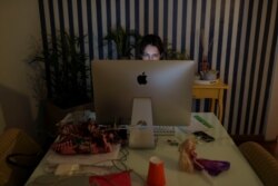 Danielle de Angelis works from home during a lockdown imposed by the state government because of the coronavirus disease (COVID-19) outbreak in Santo Andre, Brazil, March 26, 2020.