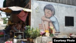 Graffiti in the Boeung Kak community, Phnom Penh, Cambodia. (Courtesy of Sorita Heng)
