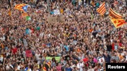 People take part in a demonstration two days after the banned independence referendum in Barcelona, Spain, Oct. 3, 2017. 