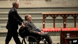 Former Presidents George W. Bush, left, and George H.W. Bush arrive at St. Martin's Episcopal Church for a funeral service for former first lady Barbara Bush, Saturday, April 21, 2018, in Houston. (AP Photo/David J. Phillip )
