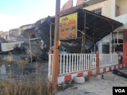 Recaptured cities and villages surrounding Mosul are in ruins, with electricity and water cut and buildings in rubble in Bartella, Iraq, Nov. 2 , 2016. (H. Murdock/VOA)