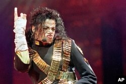 FILE - In this Aug. 25, 1993 file photo, American pop star Michael Jackson performs during his "Dangerous" tour in Bangkok.