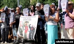 UKRAINE – Symbolic cardboard coffins near the Russian embassy in Ukraine with the inscriptions «Груз 200 ЧВК «Вагнера» ("Cargo 200. PMK Wagner") during a rally against Russian aggression in the Donbass. Kyiv, June 2, 2018