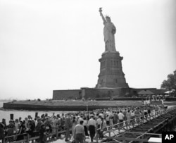 Visitors move toward the base of the Statue of Liberty on Bedloe’s Island in New York’s harbor on July 12, 1948.