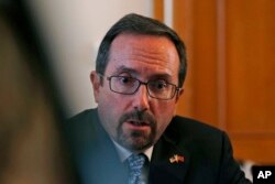 FILE - U.S. Ambassador John Bass speaks during a news conference in Ankara, Turkey, Oct. 11, 2017.