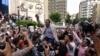FILE - Khaled Elbalshy demonstrates with fellow journalists outside the Journalists Syndicate headquarters in Cairo, May 4, 2016, following the arrests of two reporters.