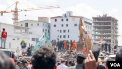 FILE: Rescue effort continues at the collapsed construction site in Sihanoukville, June 23th, 2019. (Sun Narin/VOA)