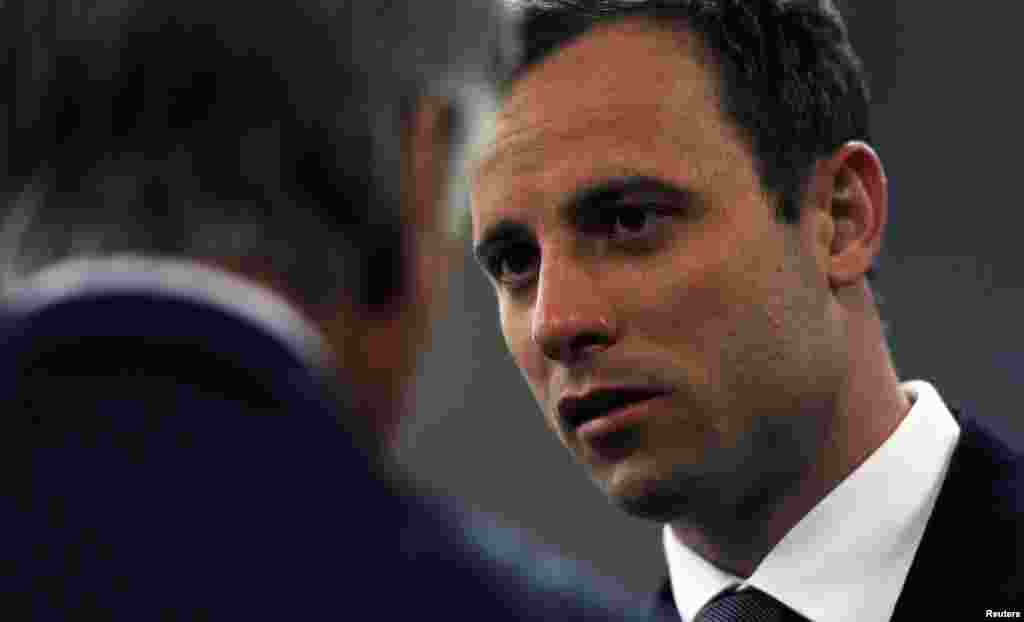 Oscar Pistorius arrives in court for the closing arguments of his trial, at the North Gauteng High Court in Pretoria, Aug. 7, 2014.