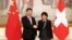 Swiss President Doris Leuthard and China's President Xi Jinping shake hands prior to their talks in Bern, Switzerland, Jan. 16 2017. 