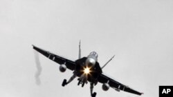 A Canadian CF-18A fighter plane prepares to land at the Birgi NATO Airbase in Trapani in the southern Italian island of Sicily, March 19, 2011