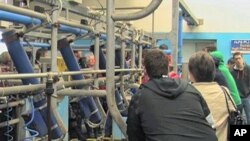 Teenagers and their parents attend an open day at Pallaskenry Agricultural College, which teaches traditional courses in farming, a few kilometers west of Limerick, Ireland, March 2012.
