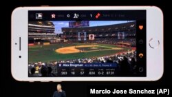 Phil Schiller, Apple's senior vice president of worldwide marketing, shows features of the new iPhone 8.