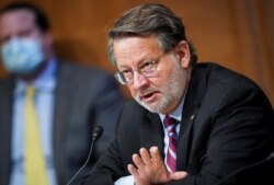 FILE - Sen. Gary Peters, D-Mich., speaks on Capitol Hill in Washington, June 25, 2020.