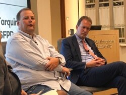 FILE - Journalist Bryan Carmody, left, is seen with lawyer Thomas Burke, Aug. 13, 2019. Carmody's home and office were raided in 2019 in a probe tied to the death of a San Francisco lawyer. The raids were called a violation of the California shield law.