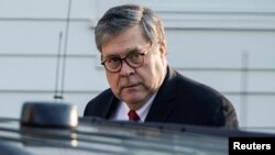 FILE - Attorney General William Barr leaves his house in McClean, Virginia, March 25, 2019.